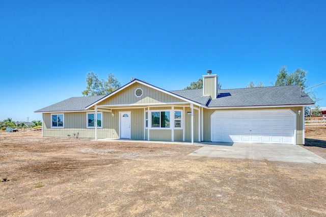 19930 Olympia Rd, Madera, CA 93638 - ranch-style home featuring an attached garage, a chimney, driveway, and roof with shingles