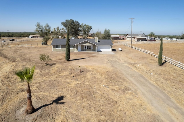 19930 Olympia Rd, Madera, CA 93638 - single story home featuring dirt driveway and an attached garage