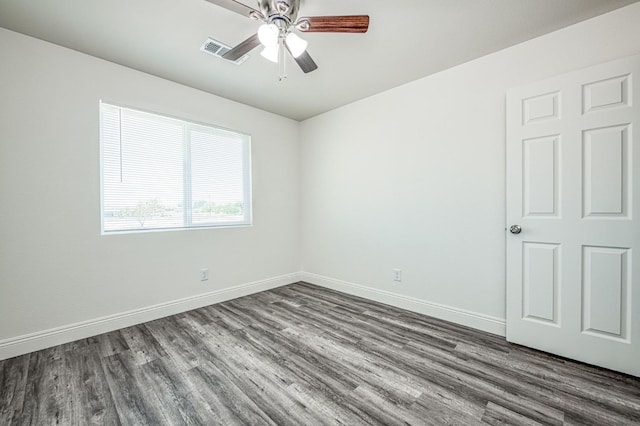 19930 Olympia Rd, Madera, CA 93638 - spare room with dark wood-style floors and a ceiling fan