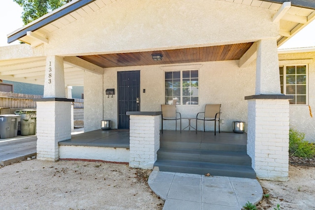 1383 N Safford Ave, Fresno, CA 93728 - view of exterior entry featuring a porch and stucco siding