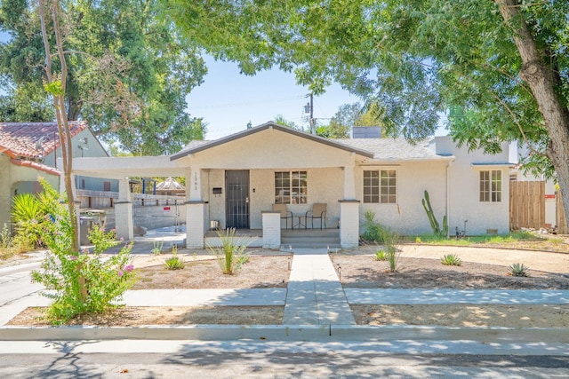 1383 N Safford Ave, Fresno, CA 93728 - view of front of home with covered porch, stucco siding, and a gate