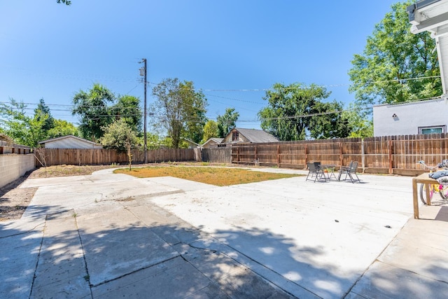 1383 N Safford Ave, Fresno, CA 93728 - fenced backyard with a patio area