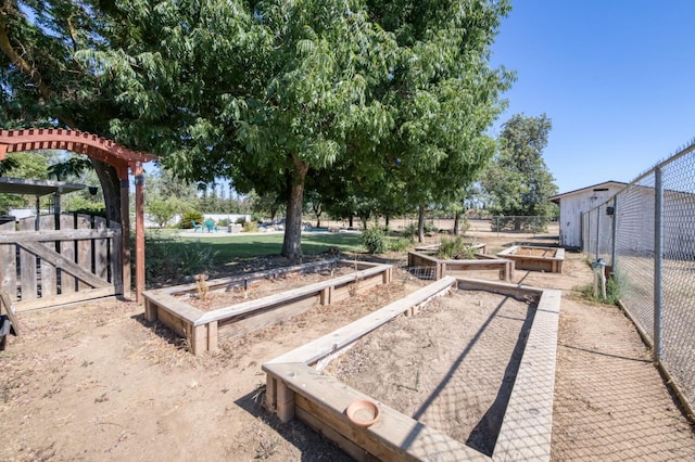 10311 E San Jose Ave, Clovis, CA 93619 - view of yard featuring a garden and a gate
