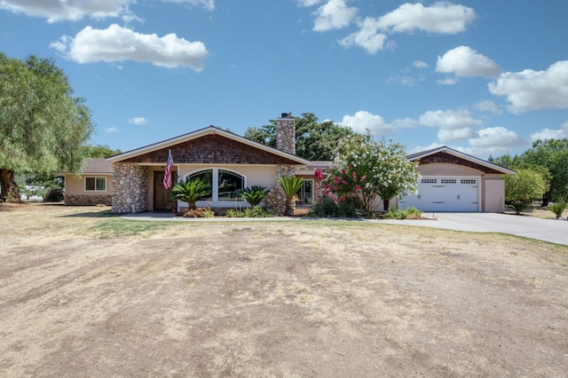 10311 E San Jose Ave, Clovis, CA 93619 - ranch-style home with a chimney, concrete driveway, and a garage