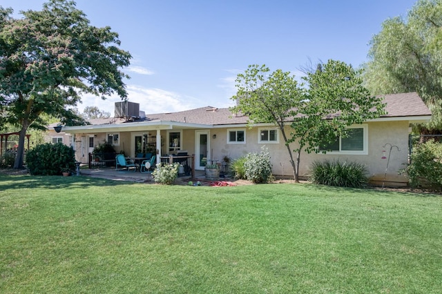 10311 E San Jose Ave, Clovis, CA 93619 - back of house featuring a patio area, a yard, and stucco siding