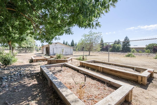10311 E San Jose Ave, Clovis, CA 93619 - view of yard featuring a garden and an outdoor structure