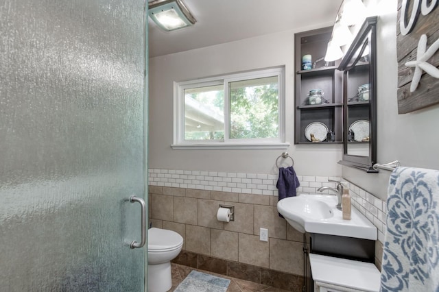 10311 E San Jose Ave, Clovis, CA 93619 - full bath featuring tile walls, vanity, a stall shower, a wainscoted wall, and tile patterned floors
