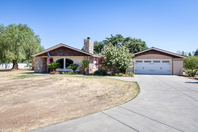 10311 E San Jose Ave, Clovis, CA 93619 - ranch-style home with a garage, driveway, and a chimney