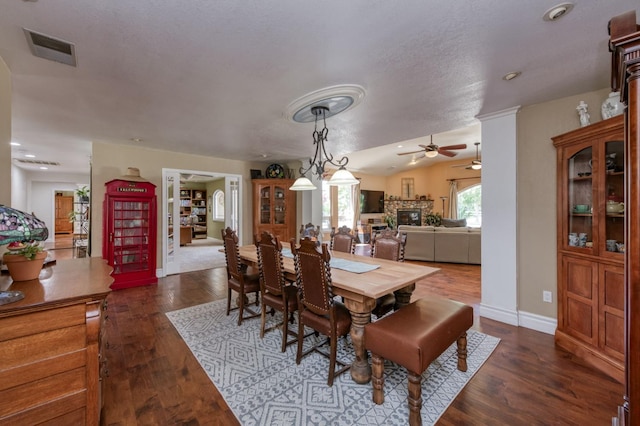 10311 E San Jose Ave, Clovis, CA 93619 - dining room featuring ceiling fan, dark wood-style flooring, recessed lighting, and a glass covered fireplace