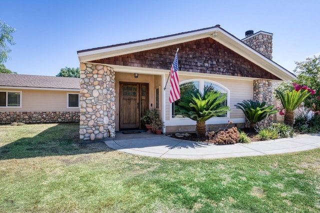 10311 E San Jose Ave, Clovis, CA 93619 - view of front of house with a chimney, a front yard, and stone siding