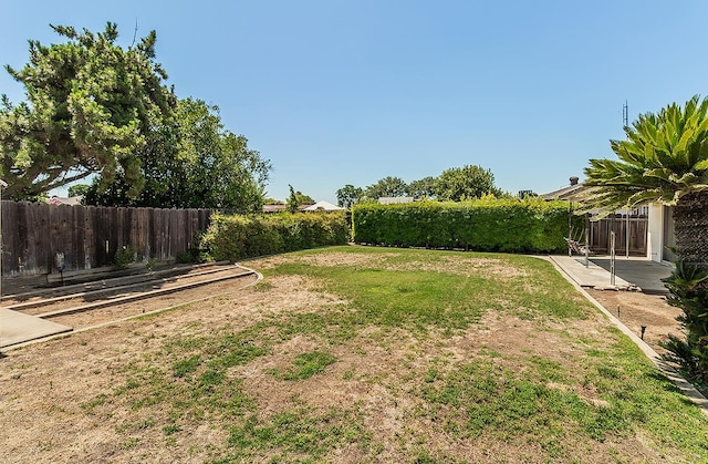 4368 N Hughes Ave, Fresno, CA 93705 - fenced backyard with a patio area