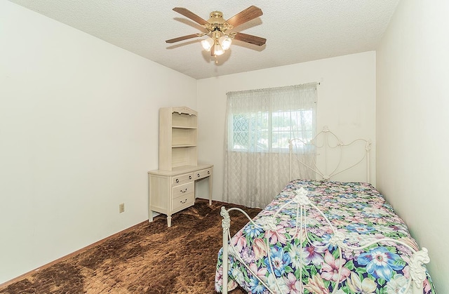 4368 N Hughes Ave, Fresno, CA 93705 - bedroom featuring dark carpet, a textured ceiling, and ceiling fan