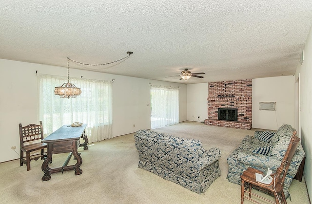 4368 N Hughes Ave, Fresno, CA 93705 - living area with a ceiling fan, light colored carpet, a brick fireplace, and a textured ceiling