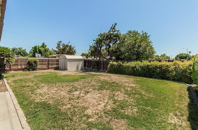4368 N Hughes Ave, Fresno, CA 93705 - fenced backyard with a storage unit