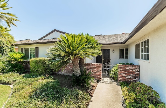 4368 N Hughes Ave, Fresno, CA 93705 - entrance to property with stucco siding