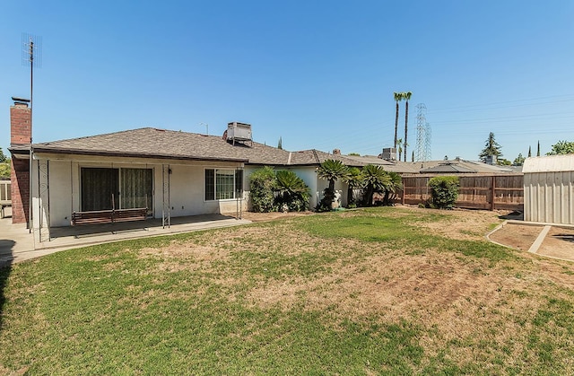 4368 N Hughes Ave, Fresno, CA 93705 - rear view of property with a chimney and a patio