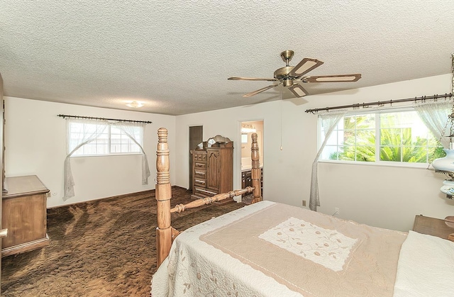 4368 N Hughes Ave, Fresno, CA 93705 - carpeted bedroom featuring a textured ceiling, ensuite bathroom, and ceiling fan