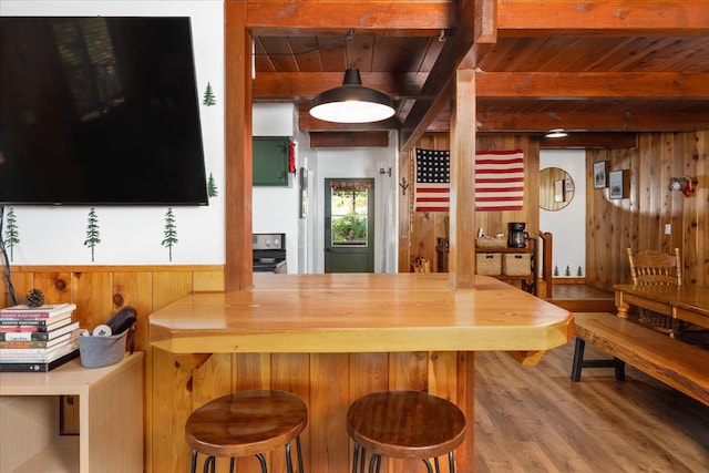 44800 Mountain Meadow Rd, Oakhurst, CA 93644 - kitchen with a wood ceiling with exposed beams, wood finished floors, wooden walls, and range