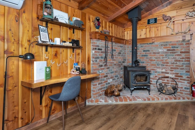 44800 Mountain Meadow Rd, Oakhurst, CA 93644 - home office with wooden ceiling, a wood stove, wood finished floors, and wooden walls