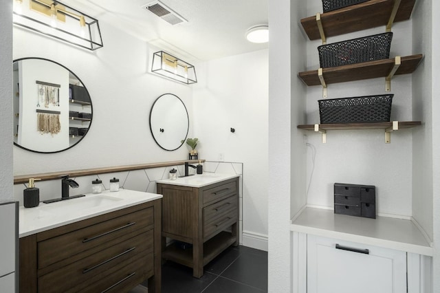 632 W Palo Alto Ave, Clovis, CA 93612 - bathroom with two vanities and tile patterned floors