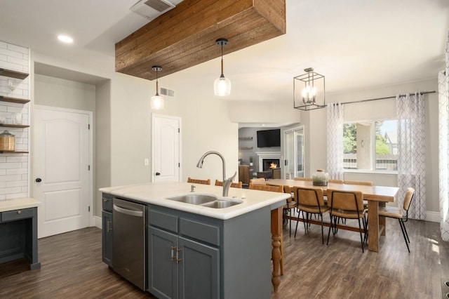 632 W Palo Alto Ave, Clovis, CA 93612 - kitchen featuring dishwasher, gray cabinets, dark wood-style flooring, light countertops, and pendant lighting