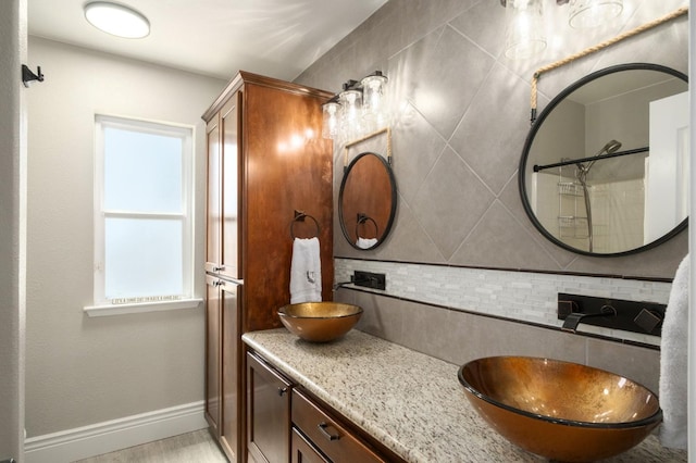 632 W Palo Alto Ave, Clovis, CA 93612 - bathroom with backsplash, healthy amount of natural light, and vanity