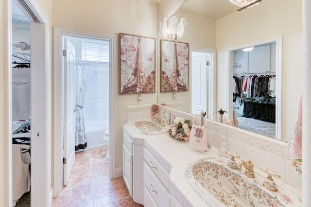 212 W Everglade Ave, Clovis, CA 93619 - full bath with double vanity, a walk in closet, and shower / bathtub combination with curtain