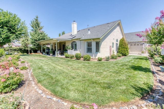 212 W Everglade Ave, Clovis, CA 93619 - back of house featuring stucco siding, a chimney, a yard, a patio, and roof with shingles