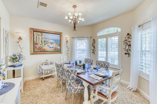 212 W Everglade Ave, Clovis, CA 93619 - dining space featuring a chandelier and carpet flooring