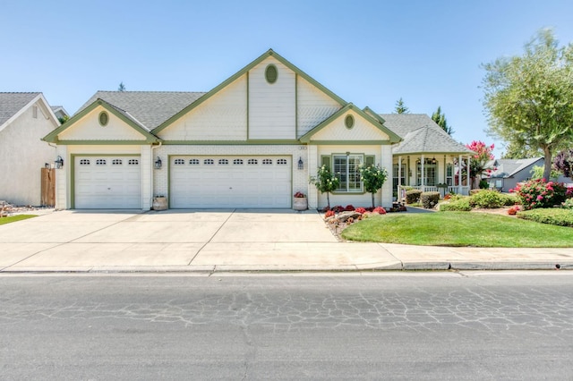 212 W Everglade Ave, Clovis, CA 93619 - view of front of home featuring a garage, a front yard, driveway, and brick siding