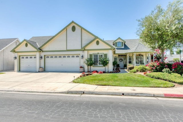 212 W Everglade Ave, Clovis, CA 93619 - view of front of house featuring a garage, a front lawn, and driveway
