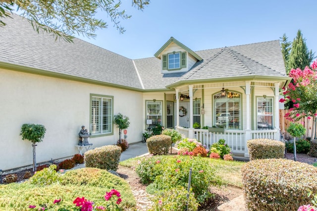 212 W Everglade Ave, Clovis, CA 93619 - view of front of home with covered porch, a shingled roof, and stucco siding