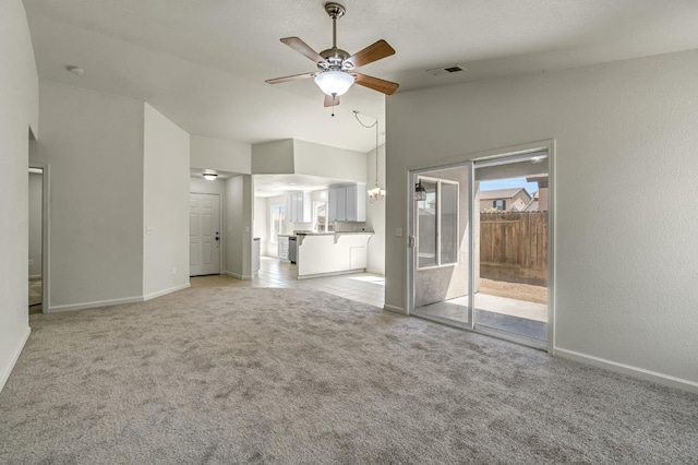 840 Morris Ln, Madera, CA 93637 - unfurnished living room featuring a ceiling fan, vaulted ceiling, light colored carpet, and a chandelier