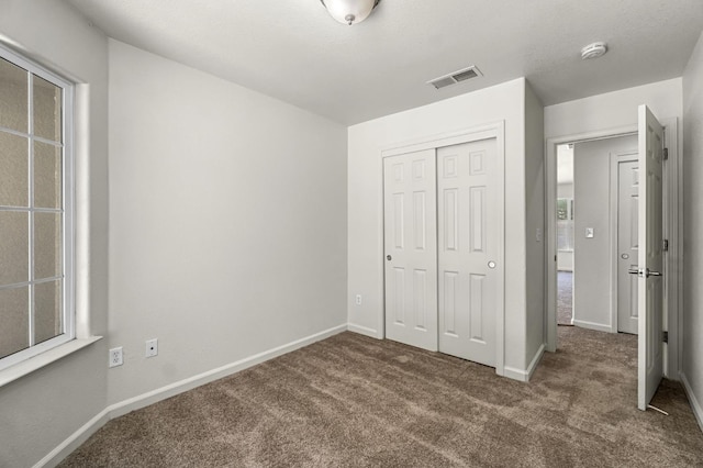 840 Morris Ln, Madera, CA 93637 - unfurnished bedroom featuring carpet flooring and a closet