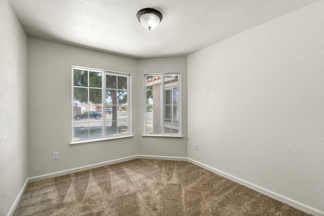 840 Morris Ln, Madera, CA 93637 - carpeted empty room featuring baseboards and a textured ceiling