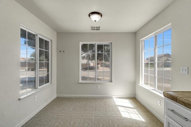 840 Morris Ln, Madera, CA 93637 - unfurnished dining area featuring baseboards
