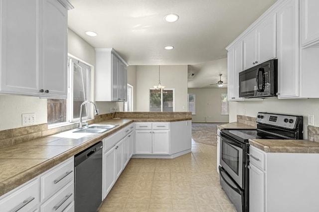 840 Morris Ln, Madera, CA 93637 - kitchen featuring appliances with stainless steel finishes, a peninsula, recessed lighting, white cabinetry, and a chandelier