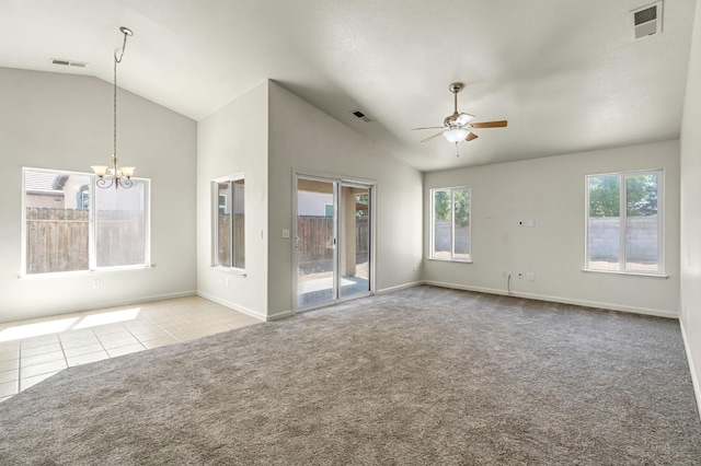 840 Morris Ln, Madera, CA 93637 - tiled spare room featuring vaulted ceiling, ceiling fan, carpet flooring, and a chandelier