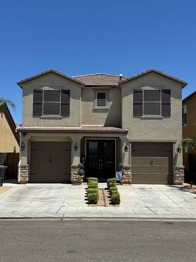 3925 Griffith Ave, Clovis, CA 93619 - view of front of house featuring stone siding, stucco siding, and a garage