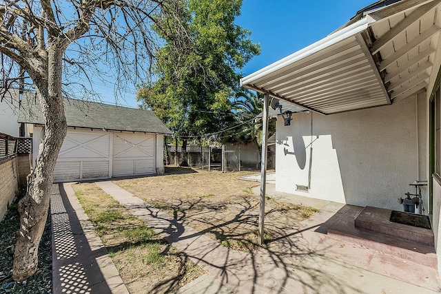 4430 E Iowa Ave, Fresno, CA 93702 - fenced backyard with a garage and an outbuilding