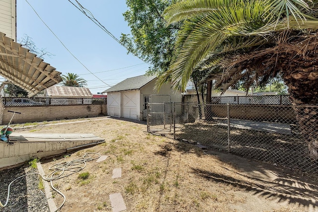 4430 E Iowa Ave, Fresno, CA 93702 - fenced backyard featuring a garage and a gate