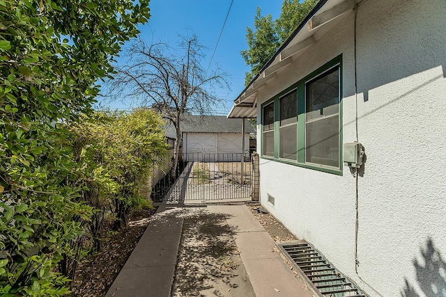 4430 E Iowa Ave, Fresno, CA 93702 - view of property exterior featuring a gate and stucco siding