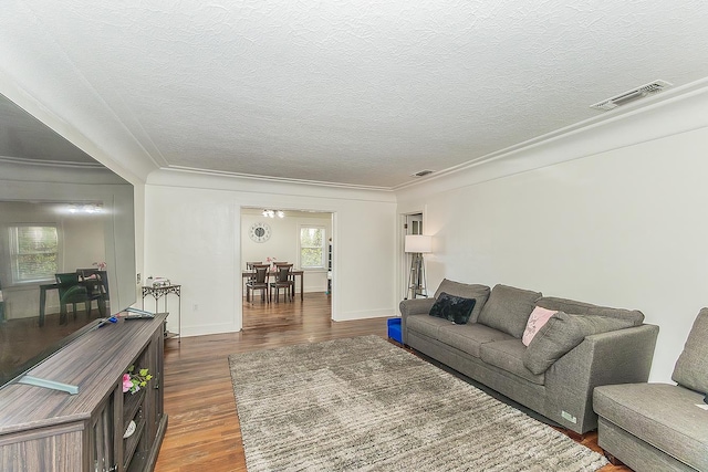 4430 E Iowa Ave, Fresno, CA 93702 - living area featuring dark wood-style flooring, a textured ceiling, ornamental molding, and an office area