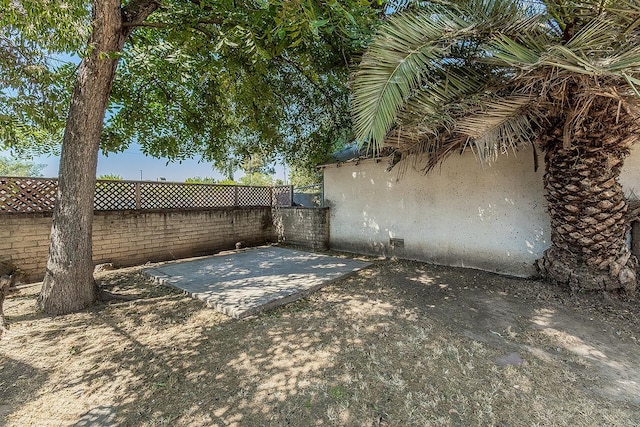 4430 E Iowa Ave, Fresno, CA 93702 - fenced backyard featuring a patio area