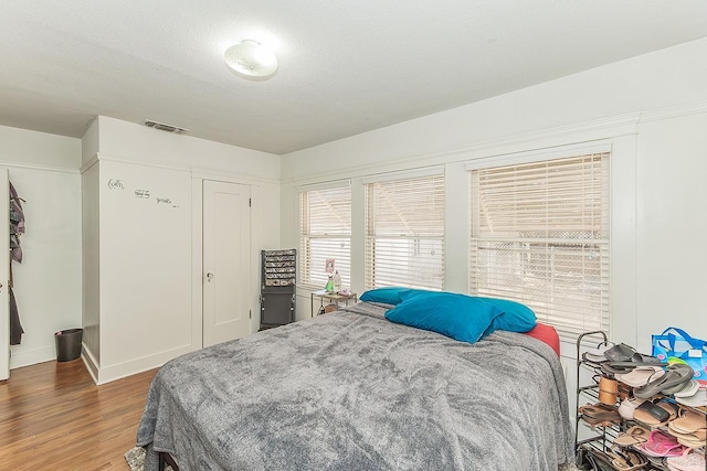4430 E Iowa Ave, Fresno, CA 93702 - bedroom featuring wood finished floors and a closet
