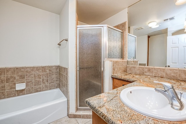 3348 W Sierra Ave, Fresno, CA 93711 - full bath featuring vanity, a stall shower, a bath, and tile patterned floors