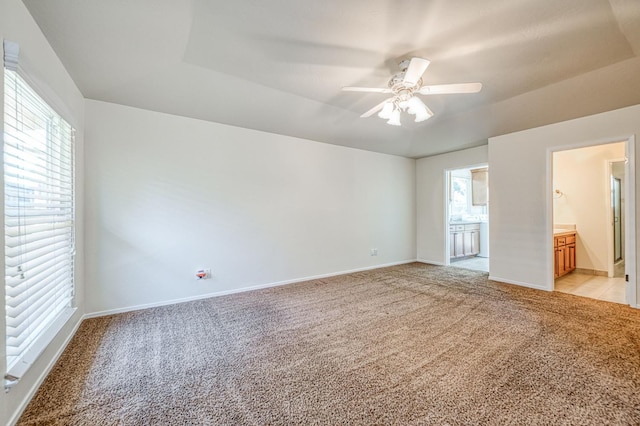 3348 W Sierra Ave, Fresno, CA 93711 - unfurnished bedroom featuring light carpet, ensuite bath, and ceiling fan