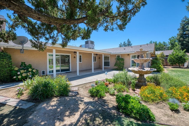 3348 W Sierra Ave, Fresno, CA 93711 - back of property with stucco siding, a patio area, and a ceiling fan