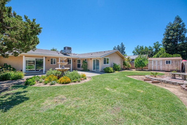 3348 W Sierra Ave, Fresno, CA 93711 - back of house featuring a storage unit and stucco siding