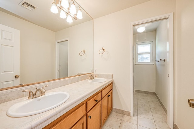 3348 W Sierra Ave, Fresno, CA 93711 - full bathroom featuring double vanity and tile patterned floors